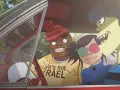 Les membres des Gorillaz dans une voiture, prêts pour une nouvelle aventure musicale. Ces personnages iconiques ont marqué plusieurs albums de Gorillaz.