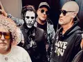 Les membres de Limp Bizkit posent ensemble, dont un avec un maquillage de squelette et un autre avec une chevelure afro.