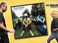 Un homme et une femme admirent la pochette de l'album "Urban Hymns" du chanteur The Verve.